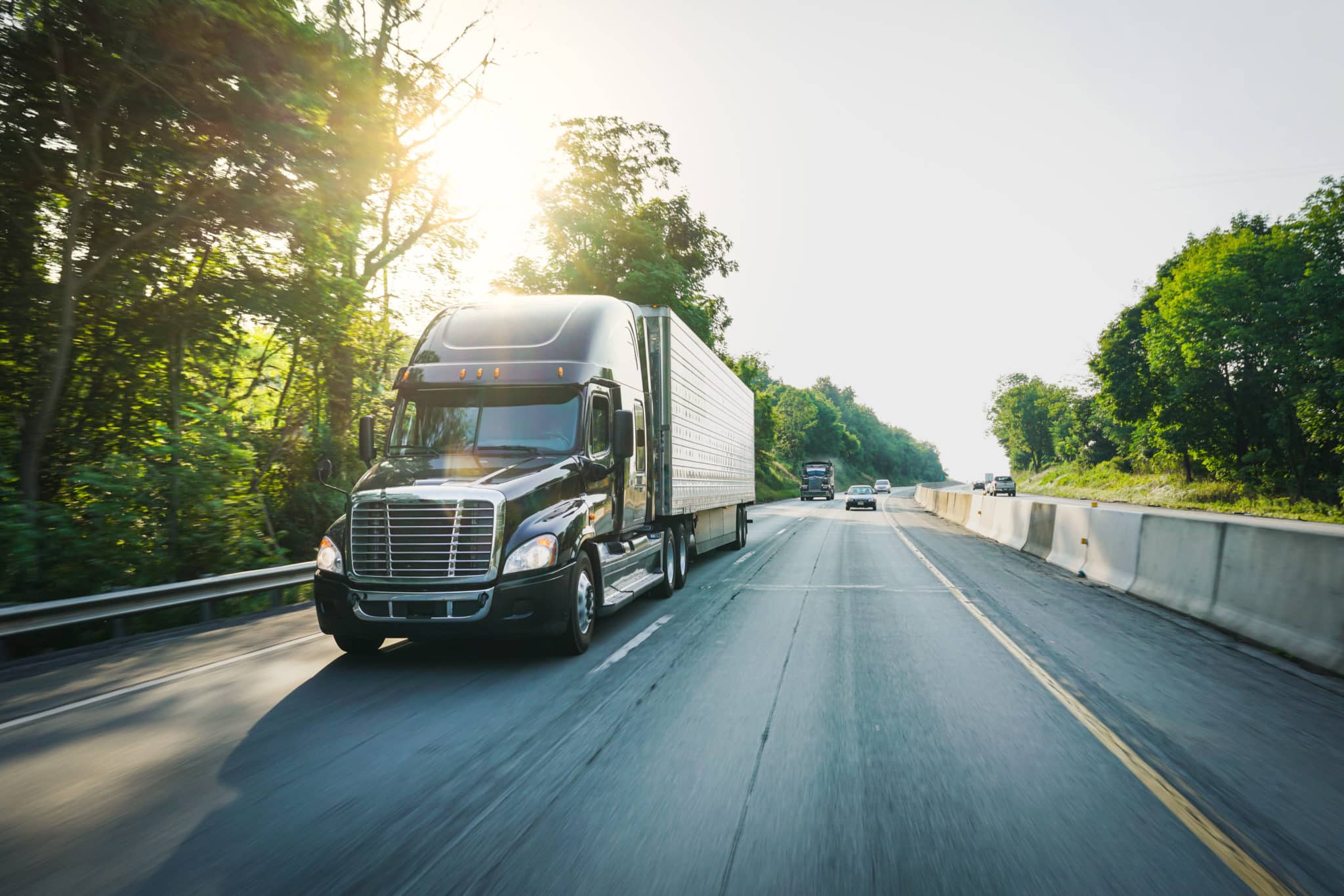 Semi-truck 18 wheeler on the highway delivering freight